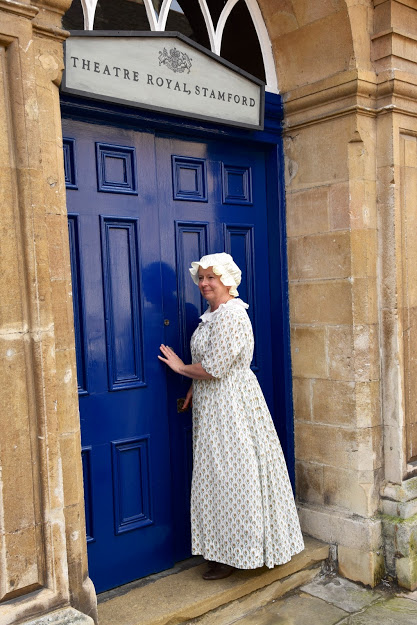 eliza at the theatre door