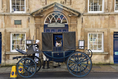 mrs s arrives in carriage